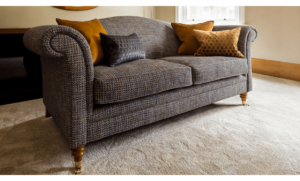Upholstered charcoal sofa with mustard cushions