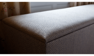 Renovated ottoman in Linwood Fable Weaves fabric